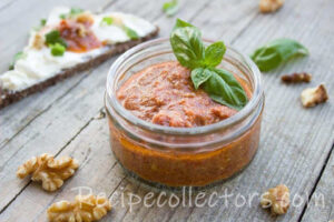 Classic BBQ Sauce in a rustic bowl with a brush, surrounded by barbecue ingredients on a wooden table.